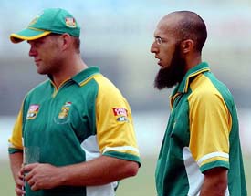 South African cricketers Jacques Kallis and Hassim Amla attend a training session in Kanpur on Thursday