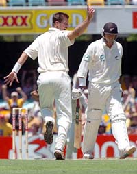 Australian bowler Michael Kasprowicz celebrates the dismissal of New Zealand captain Stephen Fleming on the first day of the first Test in Brisbane on Thursday