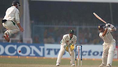 South Africa's Boeta Dippaner leaps high in the air to avoid a shot hit by Indian batsman Rahul Dravid 