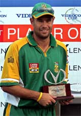 South African cricketer Andrew Hall poses with the man-of-the-match trophy 