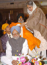 Prime Minister Manmohan Singh and his wife Gursharan Kaur pay their respects at Gurdwara Bangla Sahib in New Delhi on the occasion of the 535th birth anniversary of Guru Nanak Dev on Friday.