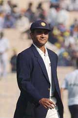 Indian captain Sourav Ganguly returns to the dressing room after losing the toss to his South African counterpart Graeme Smith