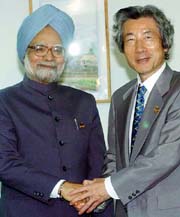 Prime Minister Manmohan Singh with Japanese Prime Minister Junichiro Koizumi in Vientiane on Monday.
