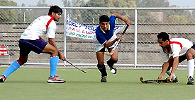 The match between Prithipal Academy and Surjit Academy in progress at the third All-India Jagtar Singh Memorial Hockey Tournament in Ludhiana on Wednesday