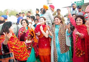 Members of the Pakistani delegation, who have come to participate in the World Punjabi Conference, enjoy at a reception held for them at Jalalpur village, near Patiala, on Thursday.