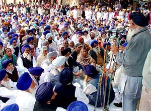 SAD President Parkash Singh Badal addresses party workers during a dharna at Bathinda on Thursday. 