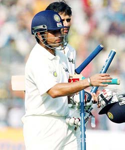 Rahul Dravid and Sachin Tendulkar return to the pavilion after India's over South Africa at the Eden Gardens in Kolkata on Thursday