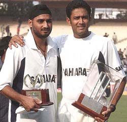 Harbhajan Singh and Anil Kumble pose with their trophies following the awards ceremony in Kolkata on Thursday