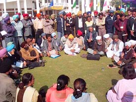 Indian and Pakistani delegates gather at an impromptu kavi darbar on Punjabi University lawns on the last day of the World Punjabi Conference in Patiala on Friday. 