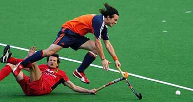 Netherlands� Timme Hoyun is tackled by Germany�s Benedikt Sperling  during a practice match in Lahore