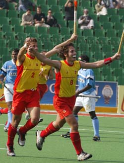 Spanish players Alex Fabregas and Santi Freixa, celebrate their victory against India in the 26th Men's Field Hockey Champions Trophy tournament at National Stadium in Lahore, Pakistan 