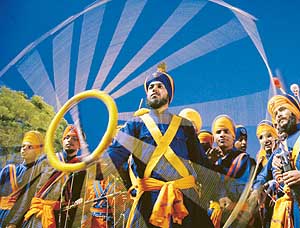 Nihang Singhs show their skills in gatka on the opening day of the Indo-Pak Punjab Games at the YPS stadium in Patiala on Sunday