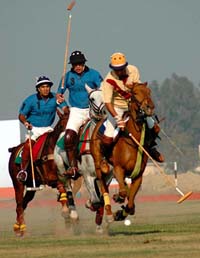 Indian Punjab skipper Capt G.S. Pandher executes an under-the-neck shot against Pakistan Punjab in their polo match in Patiala on Wednesday. 