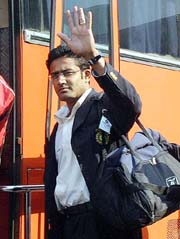 Anil Kumble waves after his arrival at the Dhaka airport on Wednesday. 