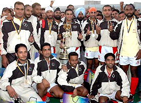 India Punjab players pose for a photograph after winning the hockey match,