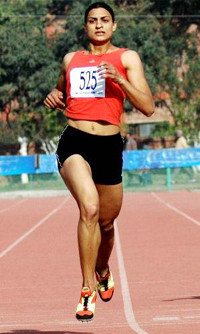 Manjit Kaur of Indian Punjab on her way to winning the gold medal in the 200m final during the first Indo-Pak Punjab Games in Patiala on Friday.