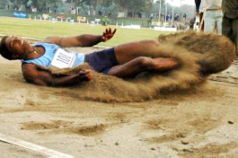 Indian Punjab�s Amritpal Singh lands in the pit at the 6.64m mark, which won him the gold medal in the men�s long jump event, during the first Indo-Pak Punjab Games in Patiala on Friday.