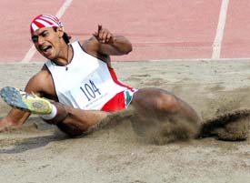 Amarjit Singh of India on way to winning the gold medal in triple jump at the Indo-Pak Punjab Games at the NIS in Patiala on Saturday