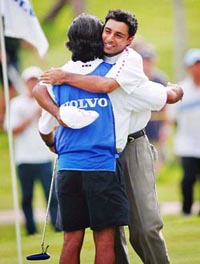 Jyoti Randhawa hugs his caddie after winning the Volvo Masters Asia 2004 Tournament at Kota Permai Golf & Country Club in Kuala Lumpur