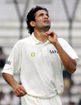 Irfan Pathan looks at a ball after claiming five wickets during the second innings of the first test in Dhaka on Sunday