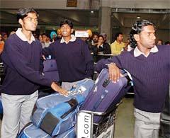 Indian hockey team members arriving at the Indira Gandhi International Airport on Monday night after participating in the Champions Trophy Tournament at Lahore. 