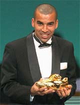 Urawa Reds forward Emerson from Brazil displays his Golden Boot award during an awarding ceremony for the outstanding players and coach of Japan's professional soccer league at Yokohama, near Tokyo, on Monday. Emerson, 2003 Player of the Year, scored 27 goals in this season, the most in J-League's first division. 