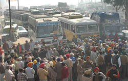 Relatives of youths languishing in Pakistani jails block traffic near the Bidhipur railway crossing on the Jalandahr-Amritsar National Highway in Jalandhar on Wednesday. 