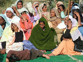 Surjit Kaur (centre) along with women of the area protests against the alleged police inaction at Sarai Amanat Khan village in Amritsar on Wednesday.