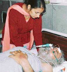 Harjinder Singh, driver of the ill-fated Jammu Tawi Express, with his daughter Sandeep Kaur at the DMC Hospital in Ludhiana.