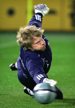 Germany's goalkeeper Oliver Kahn dives to stop the ball during a practice session at Yokohama International Stadium in Yokohama
