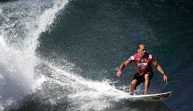Kelly Slater, 32, of Cocoa Beach, Florida, six-time world champion surfer, shoots down a perfect wave at the infamous Banzai Pipeline