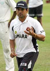 India's Sachin Tendulkar run to bowl during a practice session