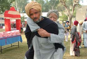 War veterans of Bathinda and Mansa districts being assisted by their kin to reach the venue of war veteran meet organised in Bathinda cantonment on the occasion of Vijay Divas