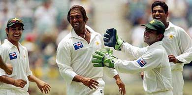 Pakistan's strike bowler Shoaib Akhtar celebrates with teammates