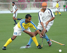 Prabhjot Singh trying to control the ball during a match between Amritsar Hockey Club and Canada's United Brothers Club
