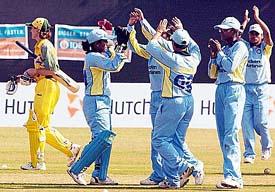 Indian women cricketers celebrate the  dismissal of Australian captain Belinda Clark