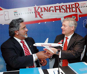 Kingfisher Airlines Chairman Vijay Mallya (L) with Airbus Chief Commercial Officer John Leahy after signing a contract in Mumbai on Saturday. 