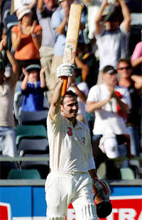 Australia�s Damien Martyn celebrates on completing his century on the third day of the first Test against Pakistan at the WACA ground in Perth on Saturday. 