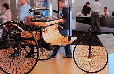 Malaysians look at the world�s first automobile, the Benz Patent Motor Car 1886, at the Mercedes-Benz �The Shining Silver Star Classic Car Exhibition� in Kuala Lumpur on Sunday. The world�s first automobile was based on a holistic concept where vehicle and engine formed a well-matched, organic entity.