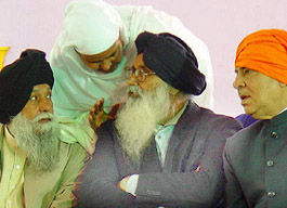 Senior BJP leader Madan Lal Khurana and former Punjab Finance Minister Capt Kanwaljit Singh look on as SGPC chief Bibi Jagir Kaur whispers something to SAD president Parkash Singh Badal at a rally held at Chamkaur Sahib on Monday.