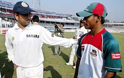 Sachin Tendulkar congratulates Bangladesh's Mohammad Ashraful for his unbeaten knock of 158 runs in the second cricket Test in Chittagong on Monday. 