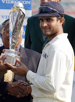 Indian cricket captain Saurav Ganguly holds the championship trophy