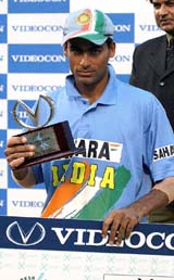 Mohammad Kaif holds the man of the match trophy after the first one-day international against Bangladesh