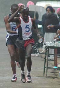 Peter of Kenya cools off during the marathon near Fatehgarh Sahib on Thursday. Peter won the race organised to commemorate the 300th anniversary of the martyrdom of Sahibzadas of Guru Gobind Singh