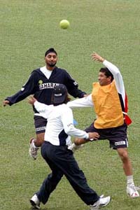 Sachin Tendulkar, Harbhajan Singh and M.S. Dhoni during a practice session in Dhaka