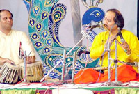 Ronu Majumdar, a renowned flutist, performs at the 129th Shree Baba Harballabh Sangeet Sammelan in Jalandhar on Saturday.