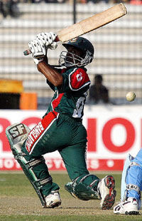 Bangladesh batsman Aftab Ahmed hits a boundary during the second ODI against India in Dhaka on Sunday