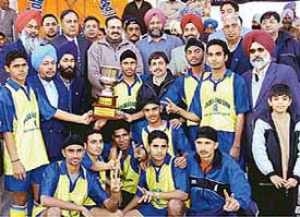 Members of the Punjab and Sind Bank Academy team after winning the Malkit Singh Sidhu Memorial Hockey Championship in Moga on Monday