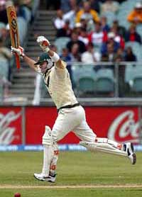 Australia�s Damien Martyn celebrates as he takes a quick single to bring up his century during the third day of the second Test in Melbourne 