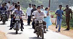 Local residents and relief workers flee to safety after a warning of another tsunami was issued on television in Cuddalore, about 180 km south of Chennai, on Thursday.